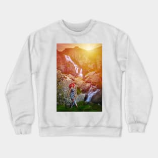 Woman by waterfall at sunset Crewneck Sweatshirt